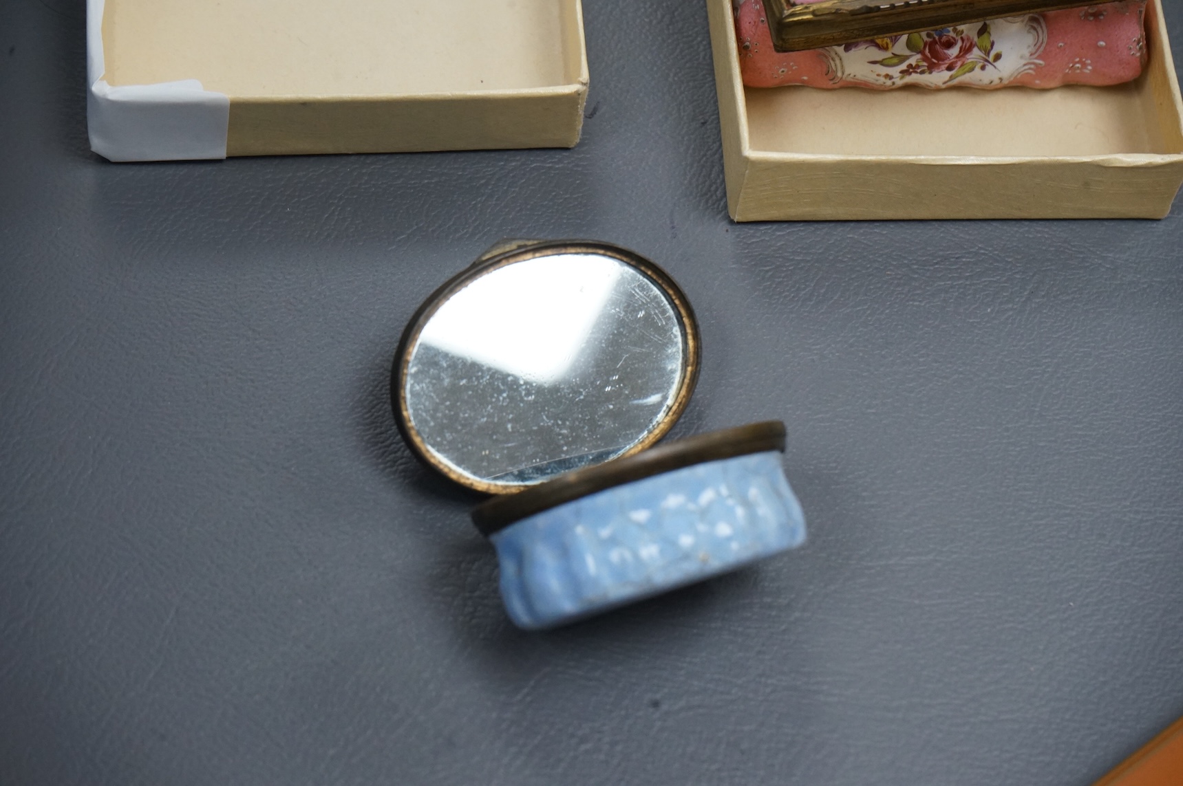 A collection of seven late 18th / early 19th century South Staffordshire enamel patch and snuff boxes and a continental porcelain snuff box, Largest 3.5cm high (8)